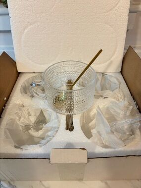 Glass cups with gold stir spoons